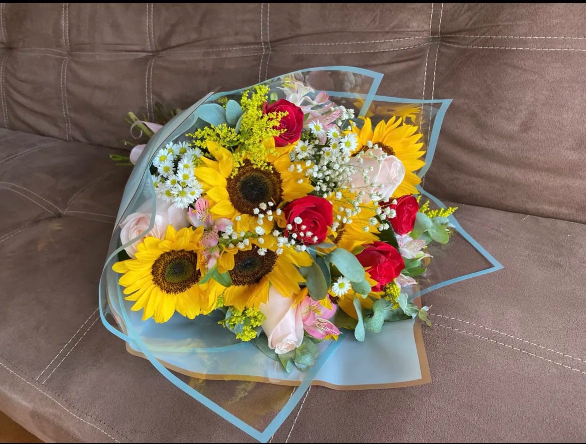 13 Roses with Sunflowers Colorful Wrapped Bouquet - 13 Roses with Sunflowers, Alstroemeria with White Montecasino, Baby Breath, Solidago and Eucalyptus Accents. Paper and Flower color may vary depending on availability