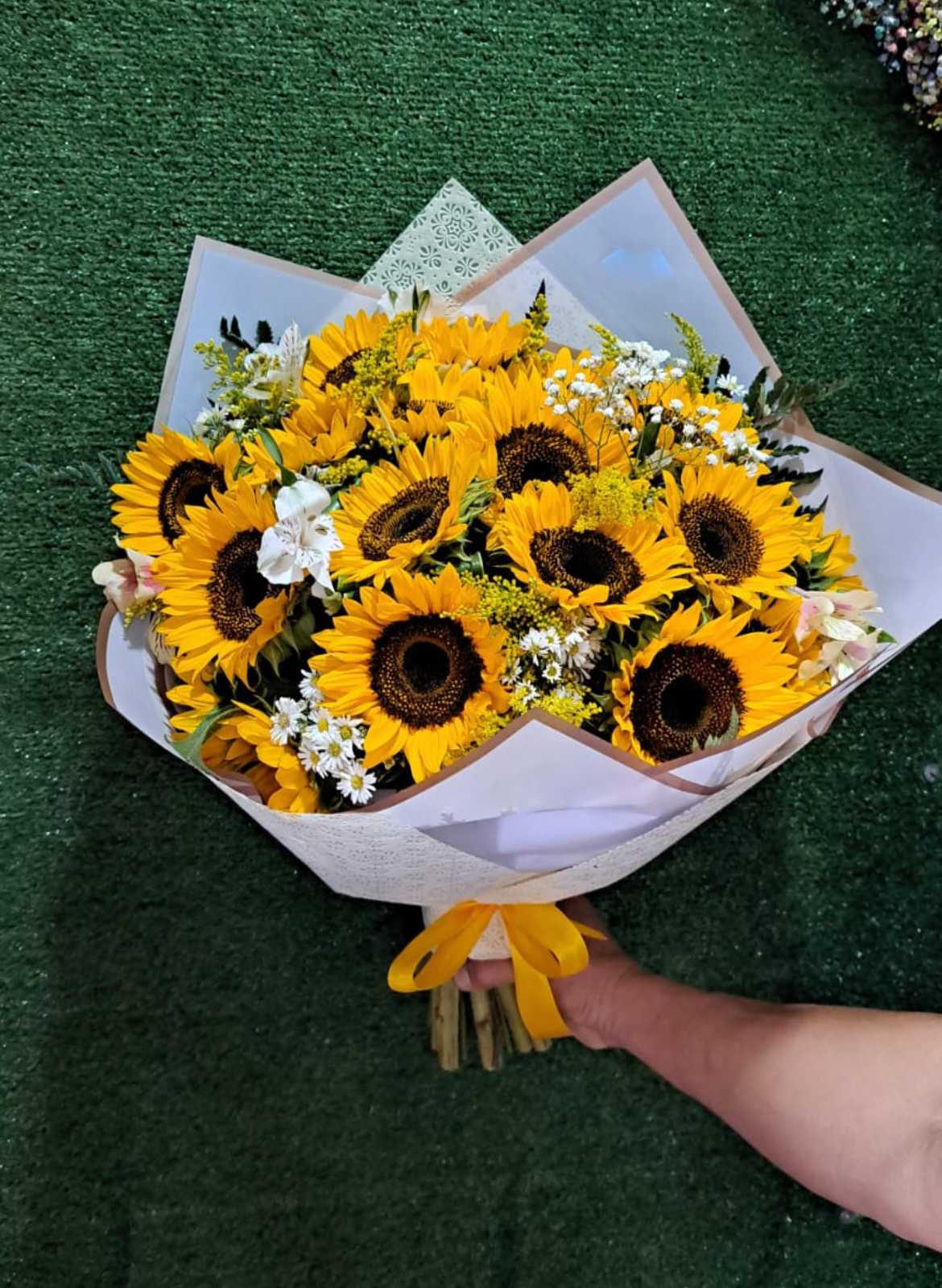 Beautiful Bouquet of 24 Sunflowers - 24 Sunflowers in a Wrapped Bouquet with Solidago, Baby Breath, White Alstroemerias and White Montecasino Accents. Paper color may vary depending on availability