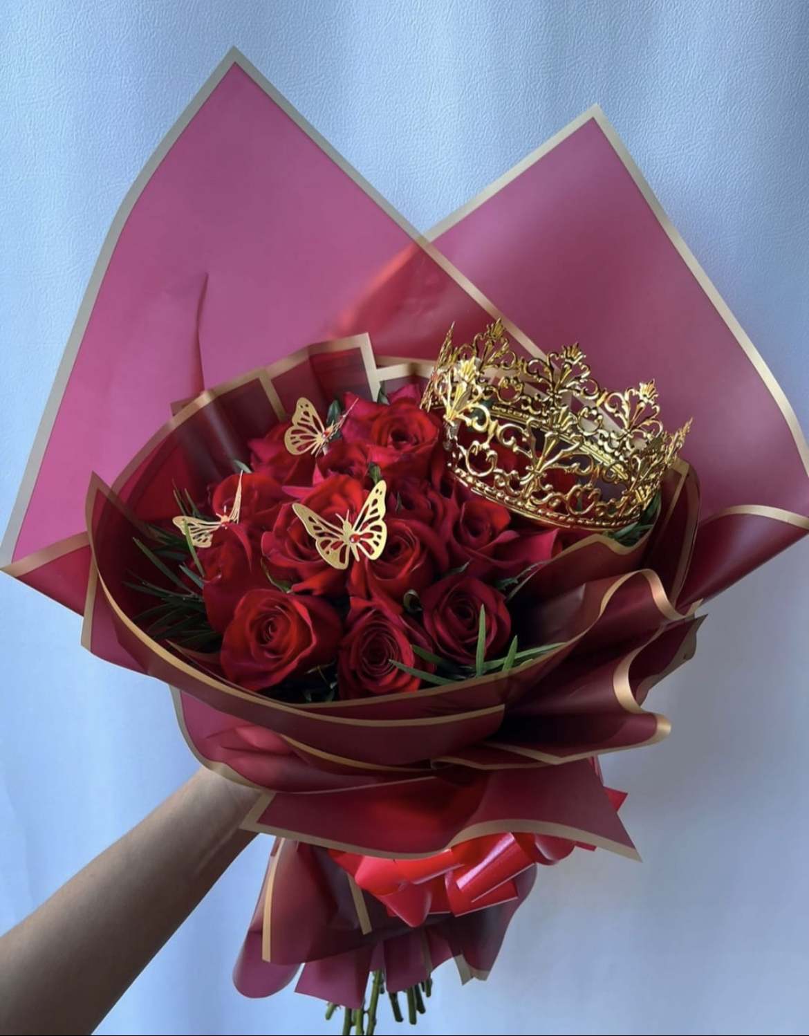 18 Red Roses in a Premium Wrapped Bouquet - 18 Red Roses in a Premium Wrapped Bouquet **Includes Butterflies and a Crown** ****Paper color may vary depending on availability****