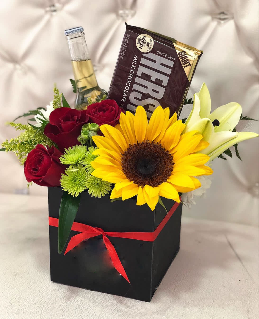 Black Gift Box with Chocolate and Beer. - Black Gift Box of Sunflowers, Lilies, Roses, Cushion Pom with Solidago Accents. ***INCLUDES Chocolate and Beer ****