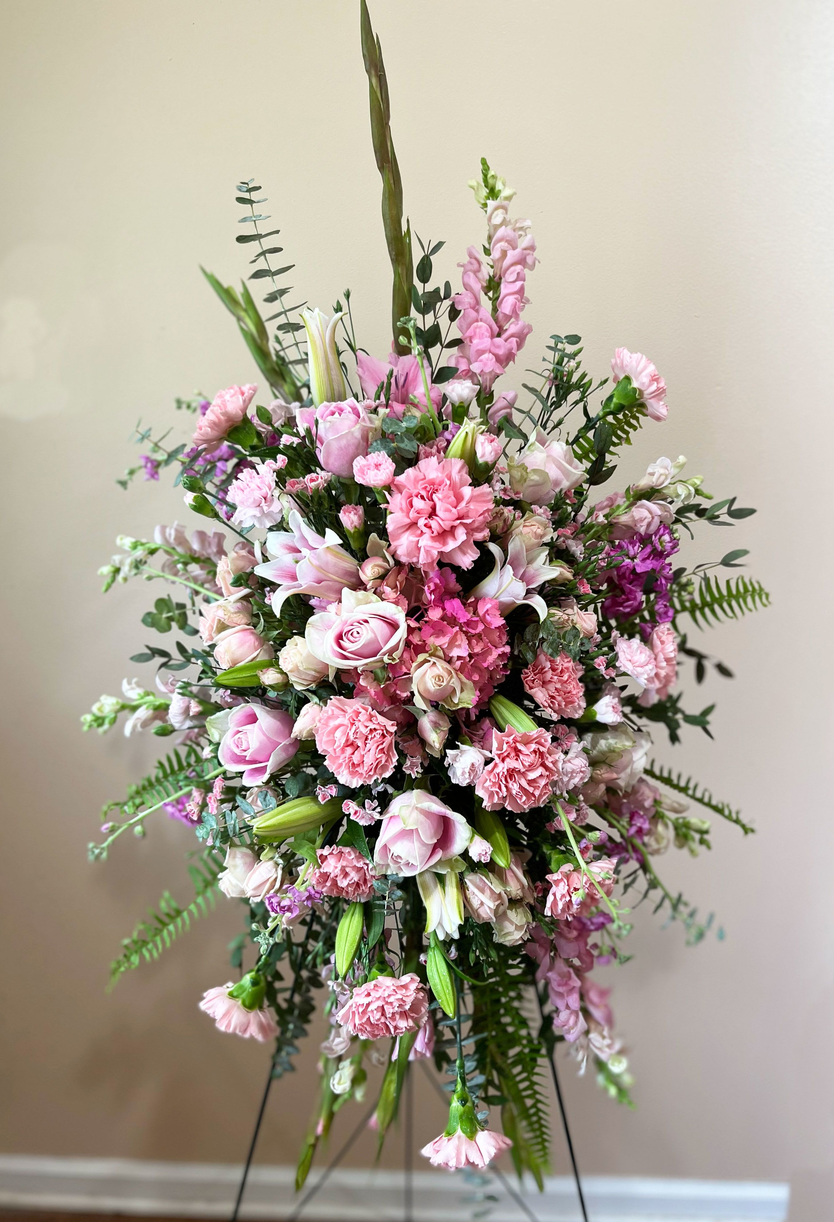 Standard Garden Easel - Take a walk through the garden of memories with this lush spray of pink blooms, accented with fresh greens. It's a joyful expression of sympathy sure to be appreciated.
