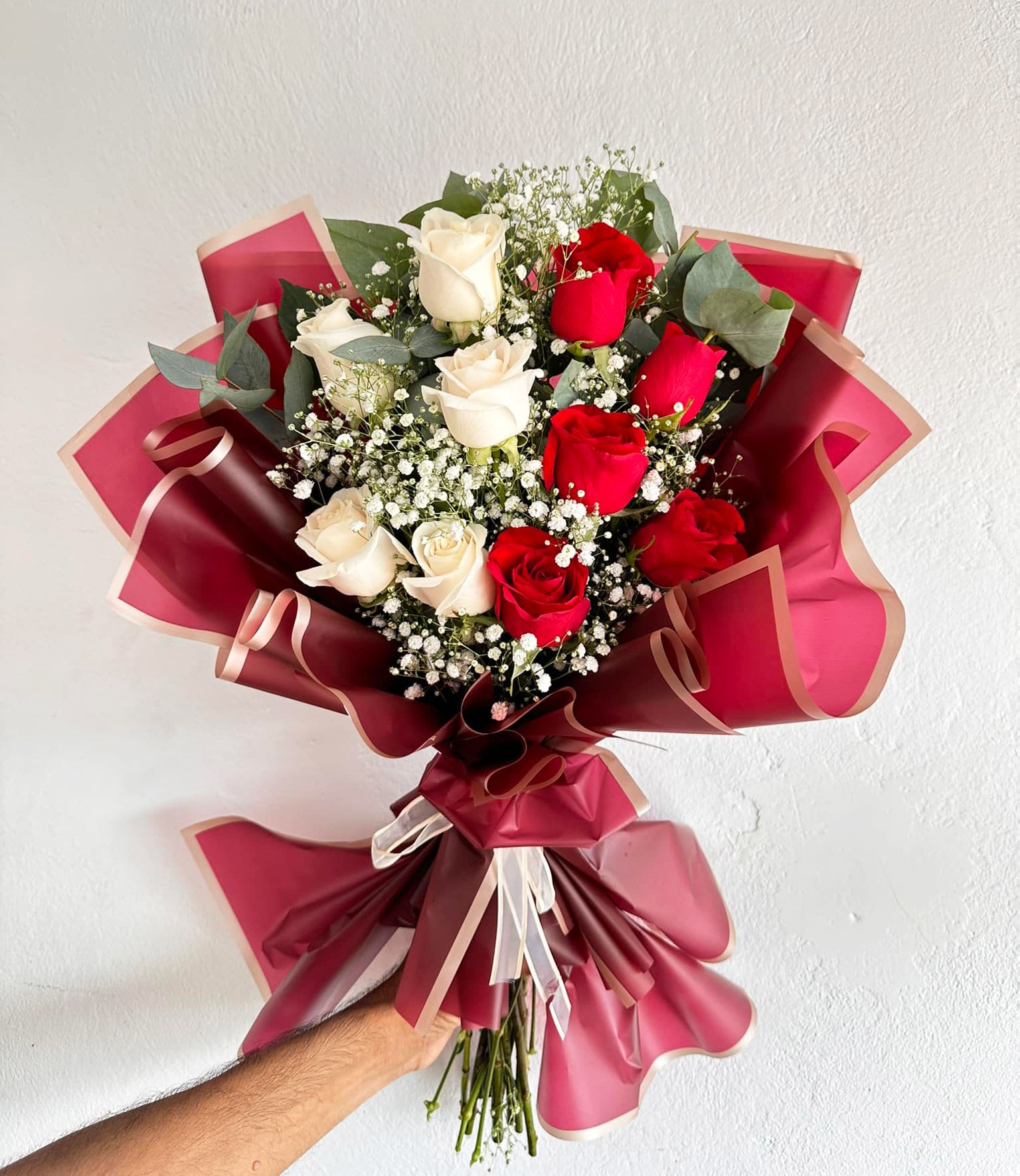 5 White and Red Roses Bouquet - 5 White Roses and 5 Red Roses in a Wrapped Bouquet with Baby Breath and Eucalyptus. Paper color may vary depending on availability. 