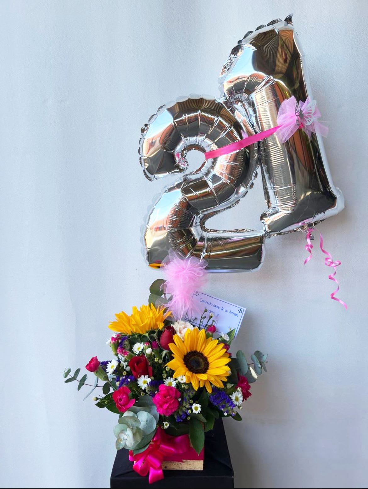 Birthday Luxe Floral Arrangement  - Celebrate a milestone birthday with elegance and color! This stunning floral arrangement features: Bright, cheerful sunflowers, Bold hot pink mini carnations Classic red roses, Playful purple statice, Dainty white Monte casino asters, Soft, natural eucalyptus greenery. *** BALLOONS INCLUDED: ONLY SILVER AND GOLD AVAILABLE, CHOOSE THE NUMBERS***