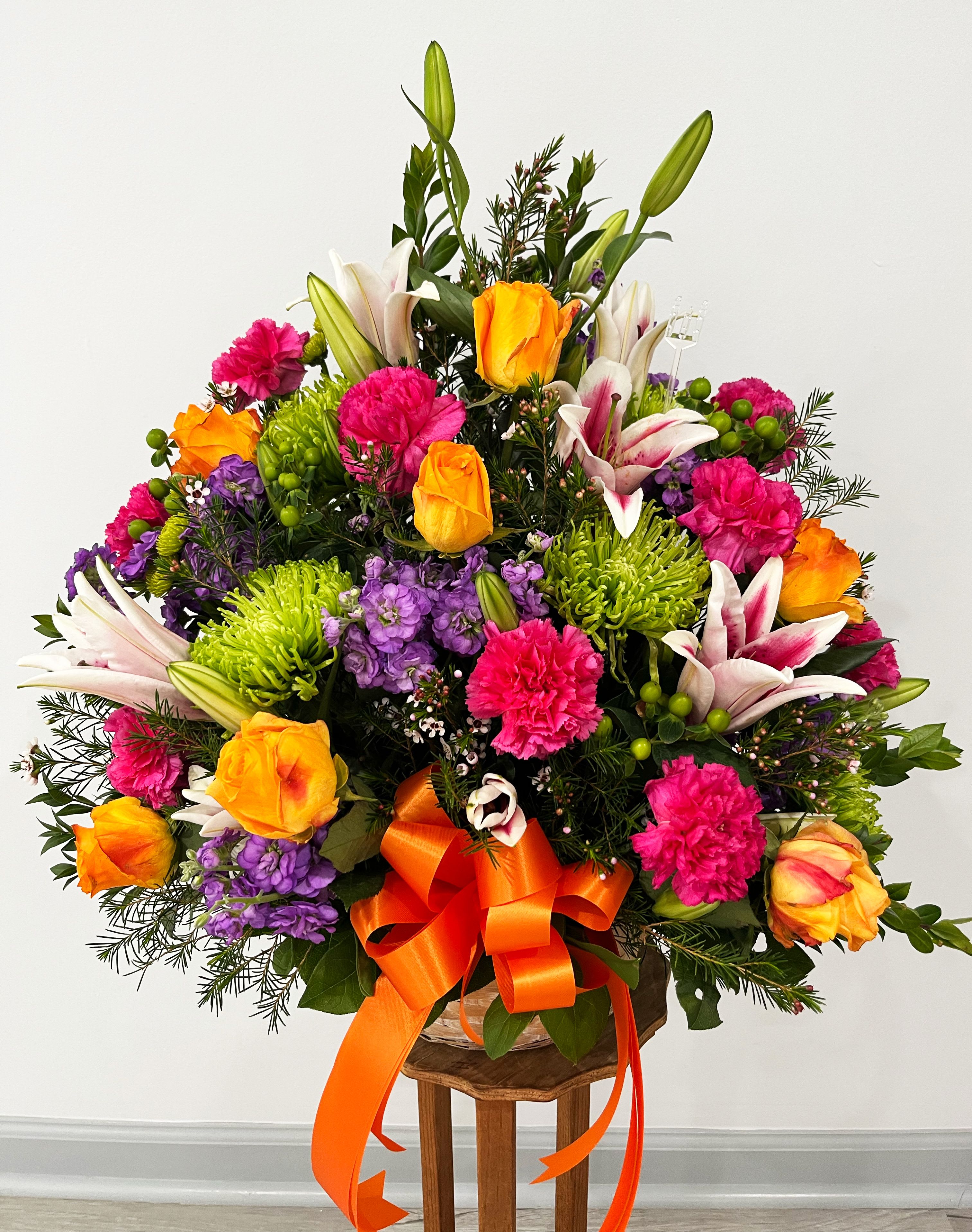 Pastel Sympathy Basket - Our Pastel Sympathy Basket is a lovely way to honor a loved one who has passed. Offering warmth and comfort, this graceful piece is artistically arranged with assorted pastel blooms. It will extend your most heartfelt condolences.  Item pictured is a depiction of an arrangement that we will make as similar as possible with the same look and feel.