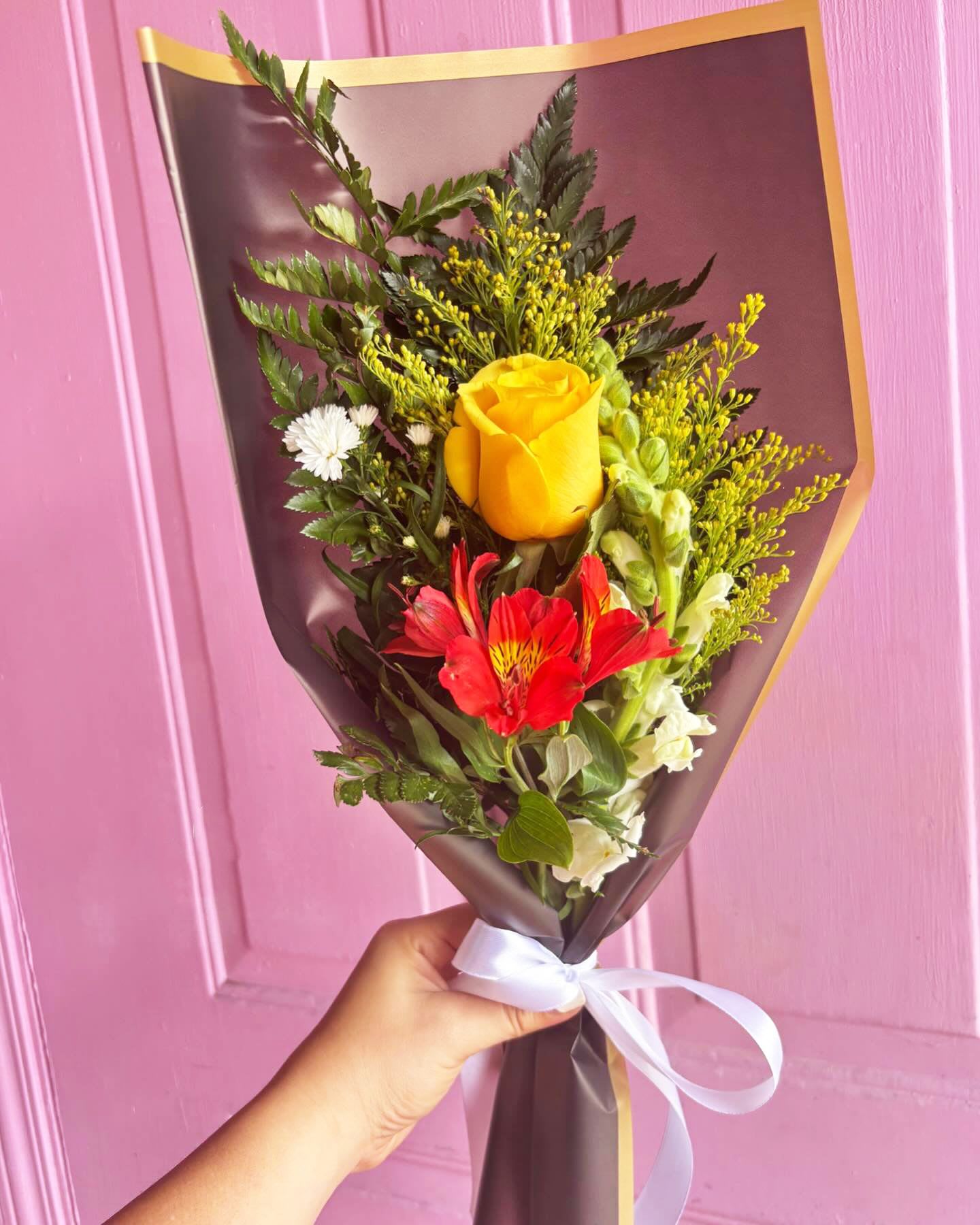 Rose Pretty Arranged Bouquet - A Rose, Alstroemeria and a Snapdragons with accents of Solidado. ***Paper and Flower color may vary depending on availability ***
