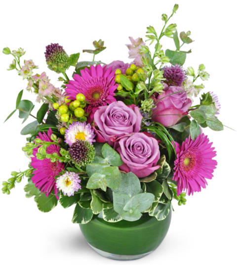 Pink and lavender bouquet in a green glass vase