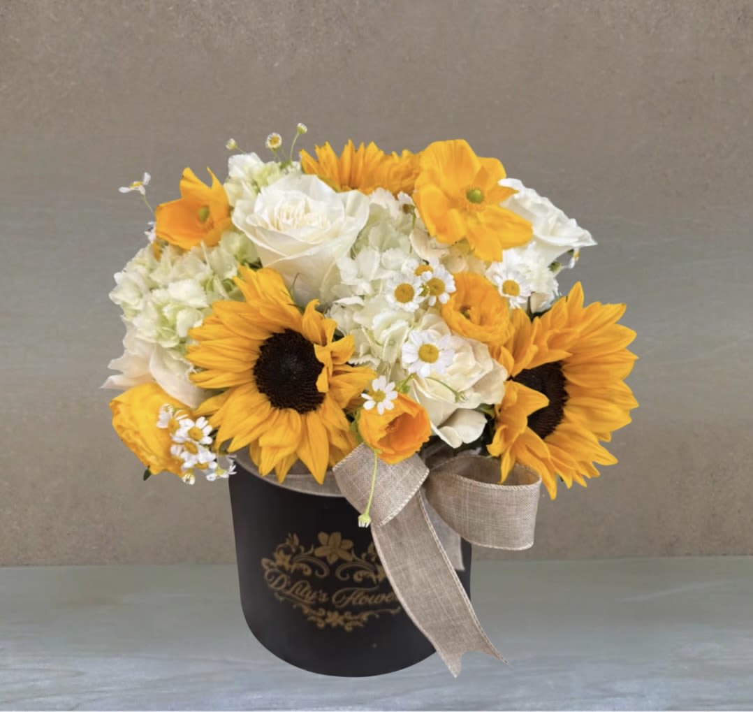 Sunflower Dream by D'Lily's Flowers  - A stunning white and yellow box. Including sunflowers &amp; other yellow and white mixed flowers to bring joy and hippieness to that special someone! DISCLAIMER: Flowers may be substituted if needed to.  