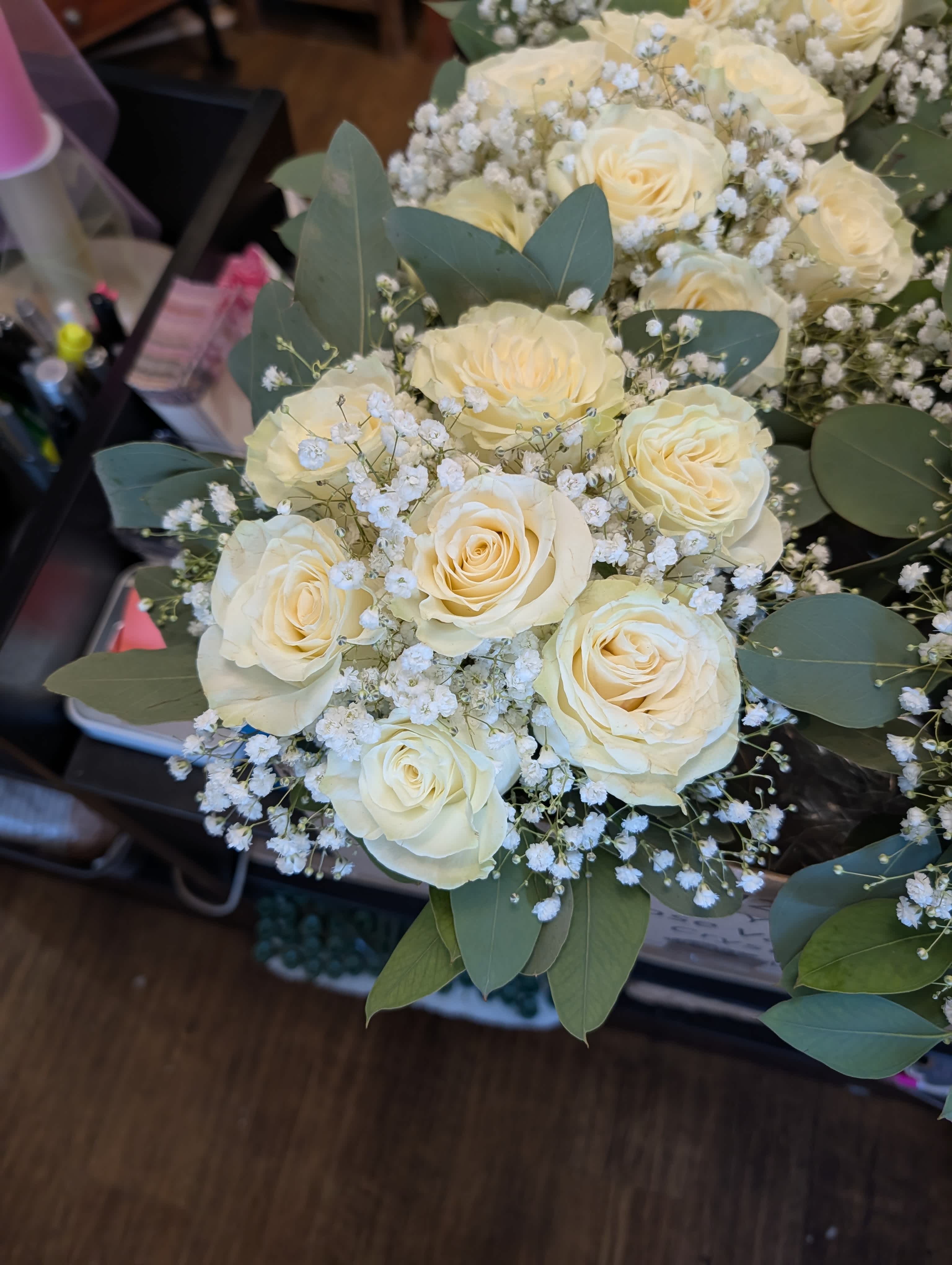 Bouquet of cream roses with baby's breath and eucalyptus
