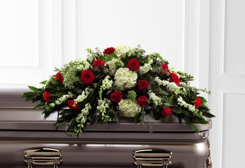 FTD Sincerity Casket Spray - The FTD Sincerity( Casket Spray is a wondrous presentation of  fresh color and beauty. Rich red roses and carnations are eye-catching  and elegant in an arrangement of white hydrangea, larkspur, snapdragons,  Queen Anne's Lace and assorted lush greens to create a lovely display  meant to bedeck the top of their casket, bringing comfort and peace to  those grieving the loss of the departed.     30""h x 48""w "
