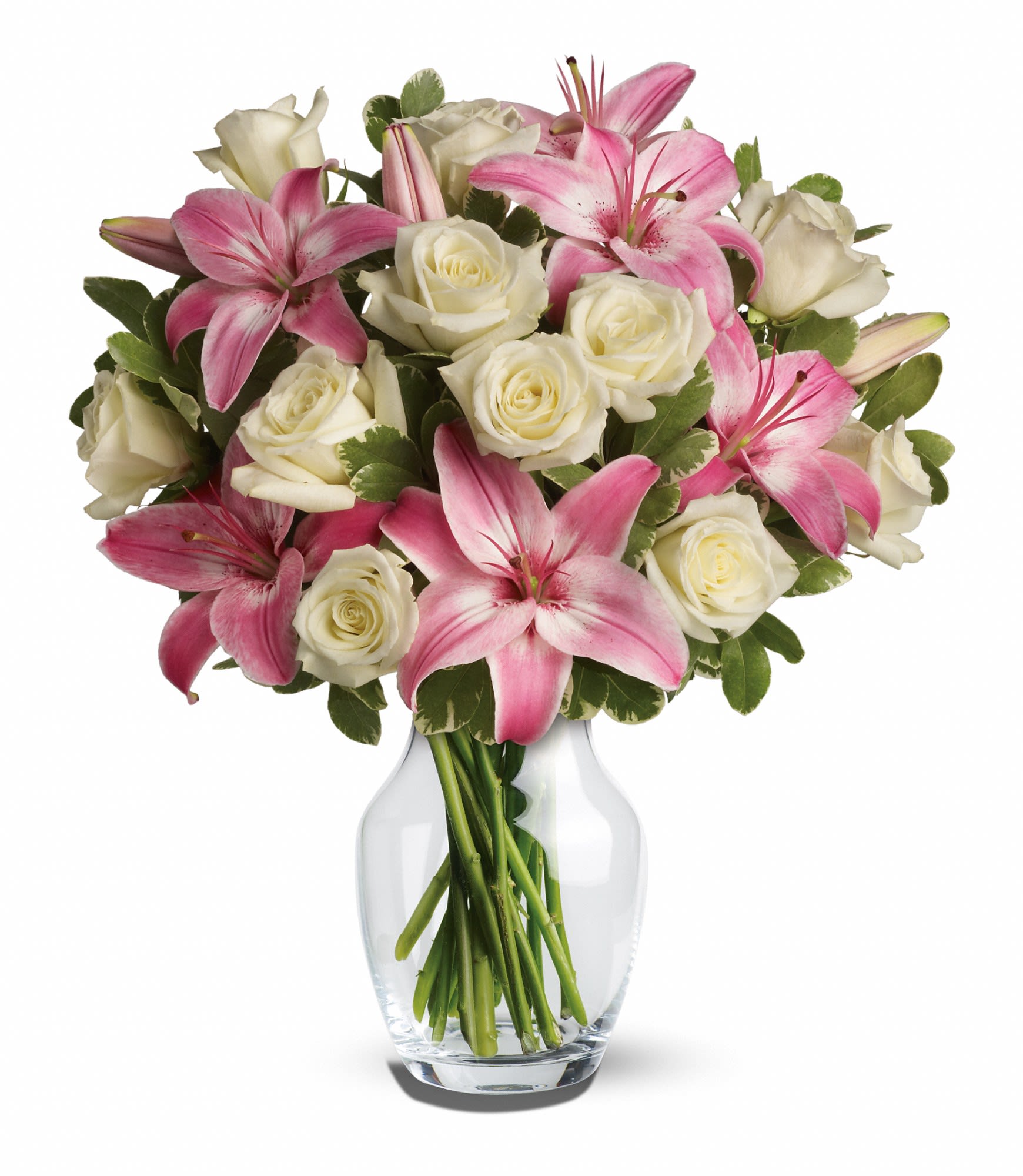 Teleflora's Always a Lady - A romantic gift like this one is always appreciated. An eye-catching display of roses and lilies is perfectly arranged in a feminine vase which makes a beautiful and lasting impression.  Elegant white roses and sweet pink asiatic lilies are hand-arranged with greens. It's the perfect way to show you love her always and forever.  Approximately 15 1/2" W x 18" H  Orientation: All-Around      As Shown : T8-1A     Deluxe : T8-1B     Premium : T8-1C  