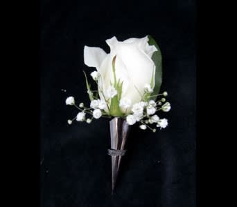 White rose boutonniere with baby's breath on a dark background