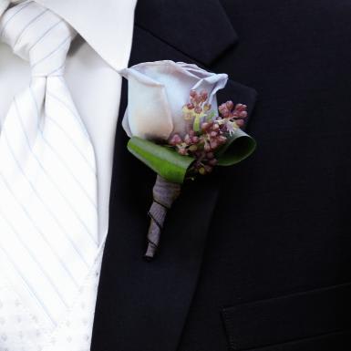 FTD Nottingham Boutonniere - The FTDÂ® Nottinghamâ¢ Boutonniere has a look of charm and elegance to  complete the look of your wedding party. A single lavender rose is  accented with lilac, green ti leaves, and a mauve satin ribbon to add to  your wedding day style. Approx. 4âH x 2'W.  