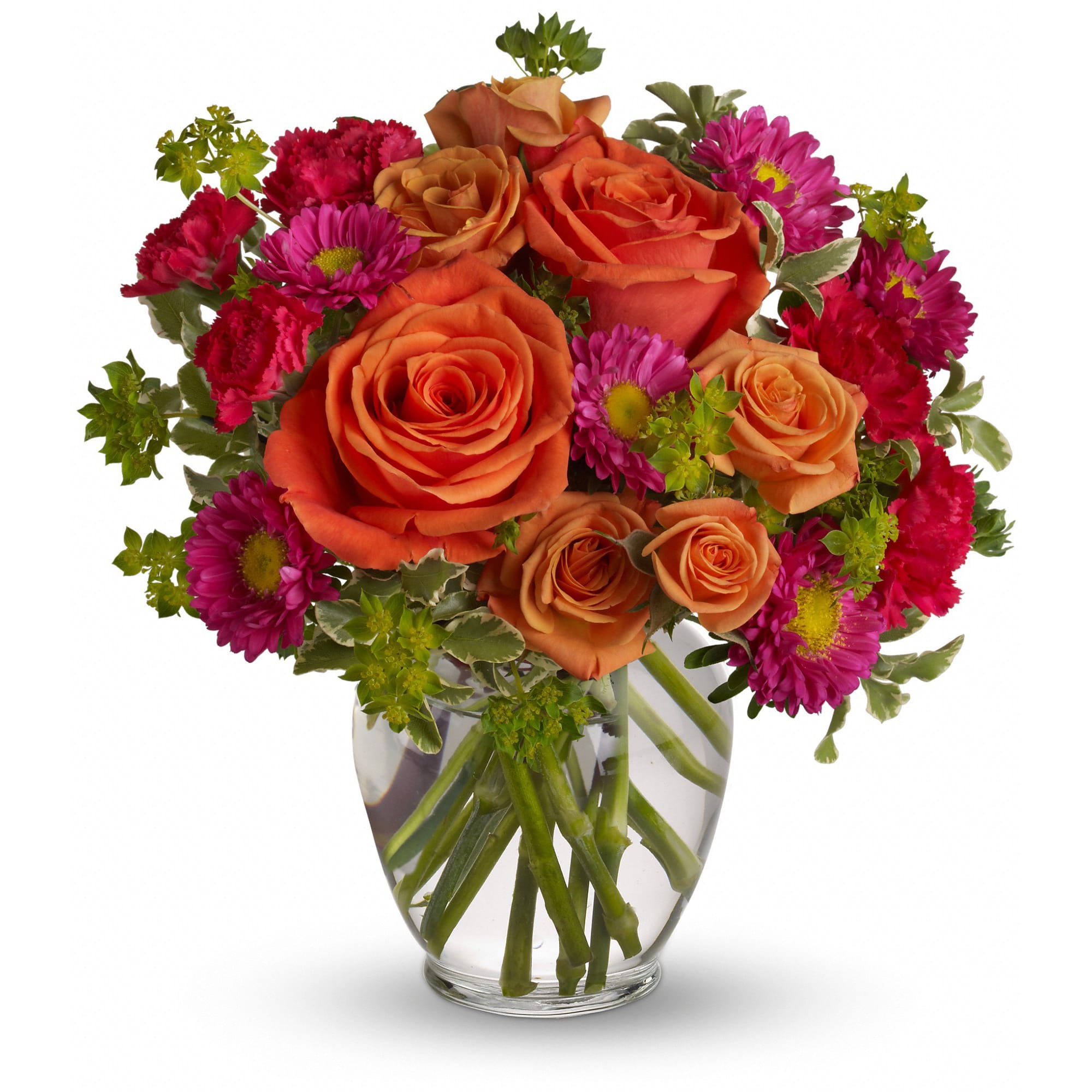Orange roses and magenta daisies in a clear glass vase