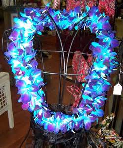 Heart-shaped floral wreath with bright blue and purple flowers