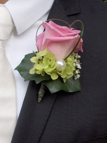 Full Sized Rose Boutonniere - A full sized rose boutonnieres in a cloud of light green accent.