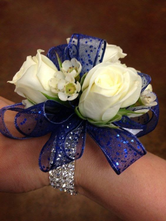 Navy and Rhinestone Corsage - Spray roses and wax flower decorated on a rhinestone band. 