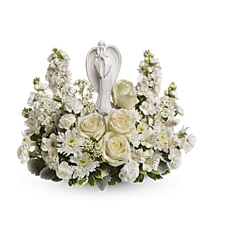 Blessed Journey - 12" keepsake angel statue in all her glory amongst a bed of absolutely beautiful white blooms. This is the perfect sympathy design to send to a memorial or funeral service, providing solace and comfort to grieving hearts.   Please call us for custom designed funeral florals .  See our custom funeral work on Instagram @flowerallieeveryday 
