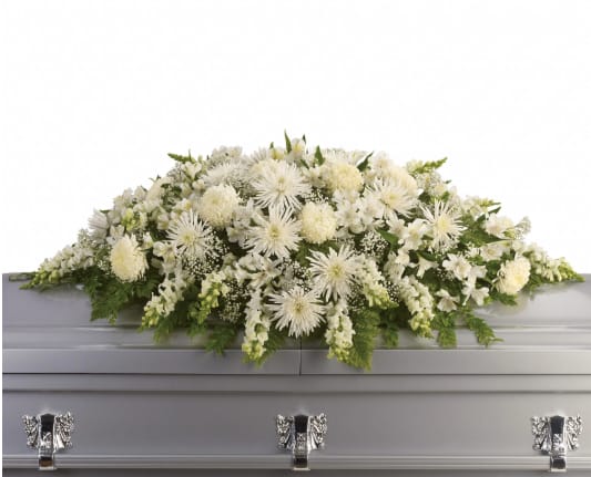 Purity and Peace Casket Spray  - A stunning yet respectful testament in white, this spray for the casket includesMums, snap dragons and babies breath