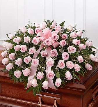 Pink Rose Casket Spray - 48 pale pink roses arranged with babies breath to adorn the casket.  This lovely funeral casket spry can be made in many different colors.   Please call us for custom designed funeral florals . We have a funeral floral specialist on staff Tuesday through Saturday and are always available for special orders by phone from 6:00am to 10:00 pm 7 days a week. After hours phone number: 714-624-1661  See our custom funeral work on Instagram @flowerallieeveryday 