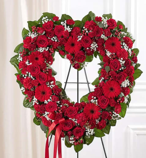 Red Heart Standing Spray - The perfect tribute for a love that will last Forever.  Please call us for custom designed funeral florals . We have a funeral floral specialist on staff Tuesday through Saturday and are always available for special orders by phone from 6:00am to 10:00 pm 7 days a week. After hours phone number: 714-624-1661  See our custom funeral work on Instagram @flowerallieeveryday 