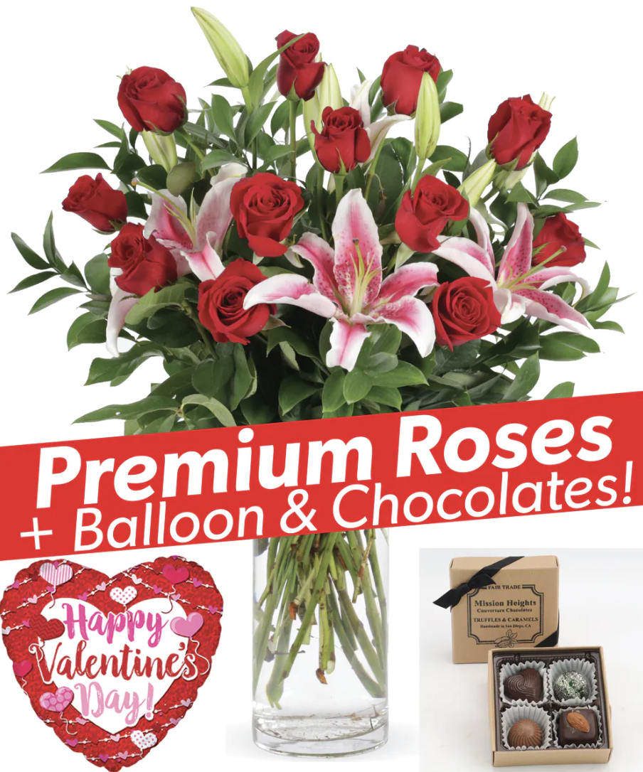 Bouquet of red roses and pink lilies with a Valentine balloon and chocolates