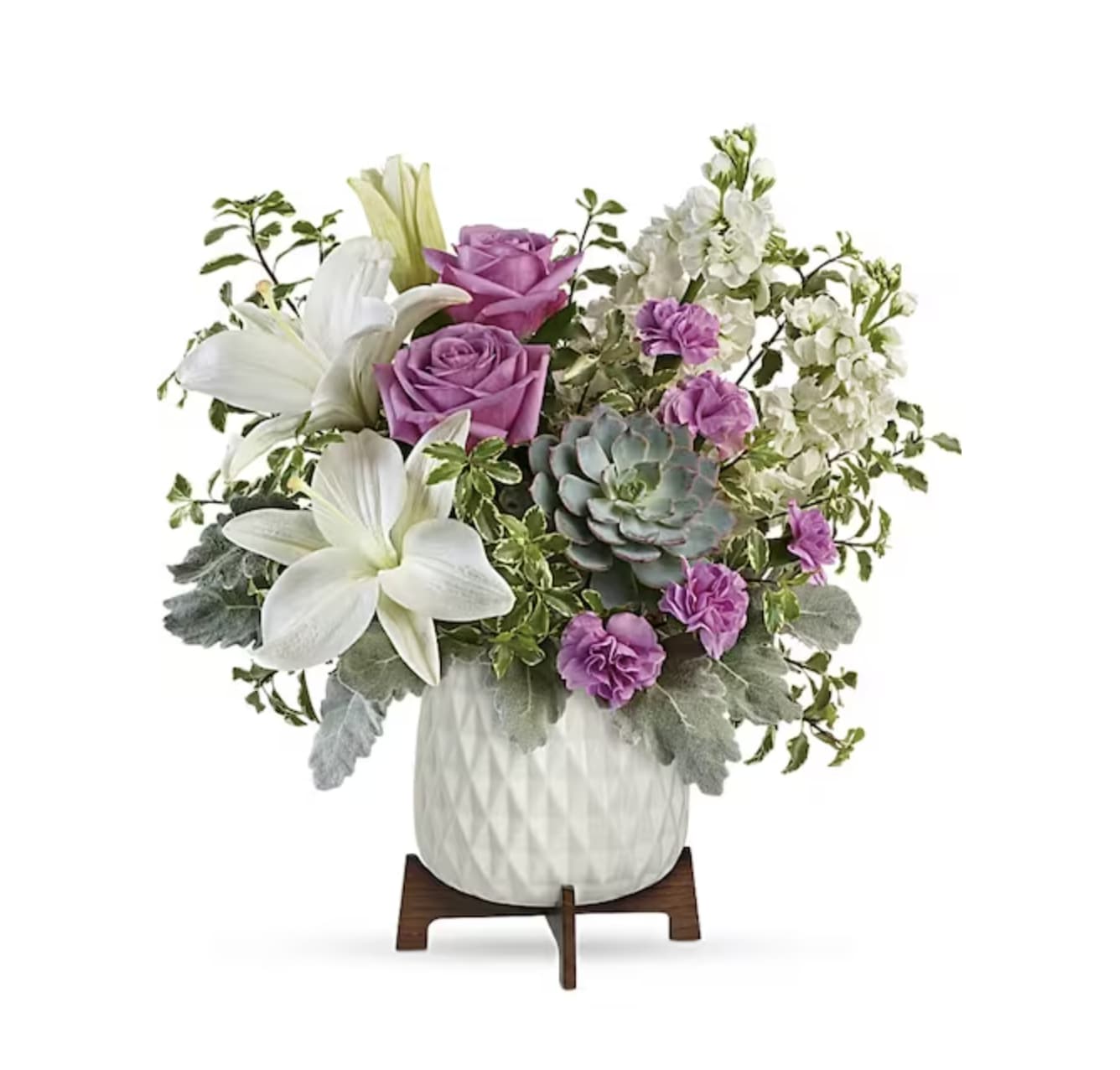 Bouquet of white lilies, purple roses, and succulents in a white vase