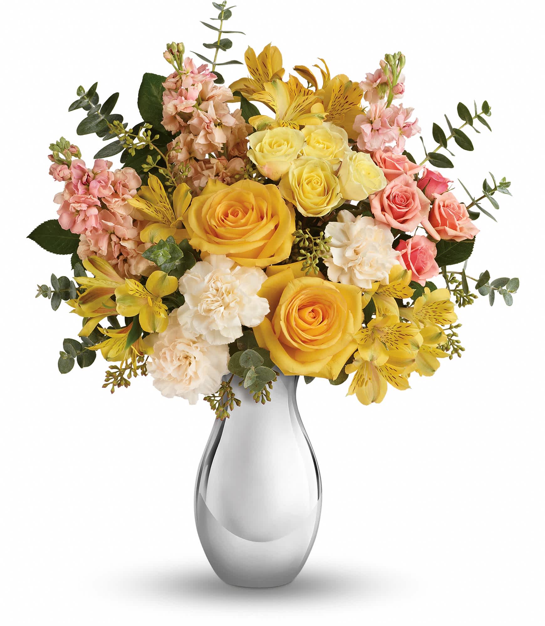 Yellow and pink flower bouquet in a clear glass vase