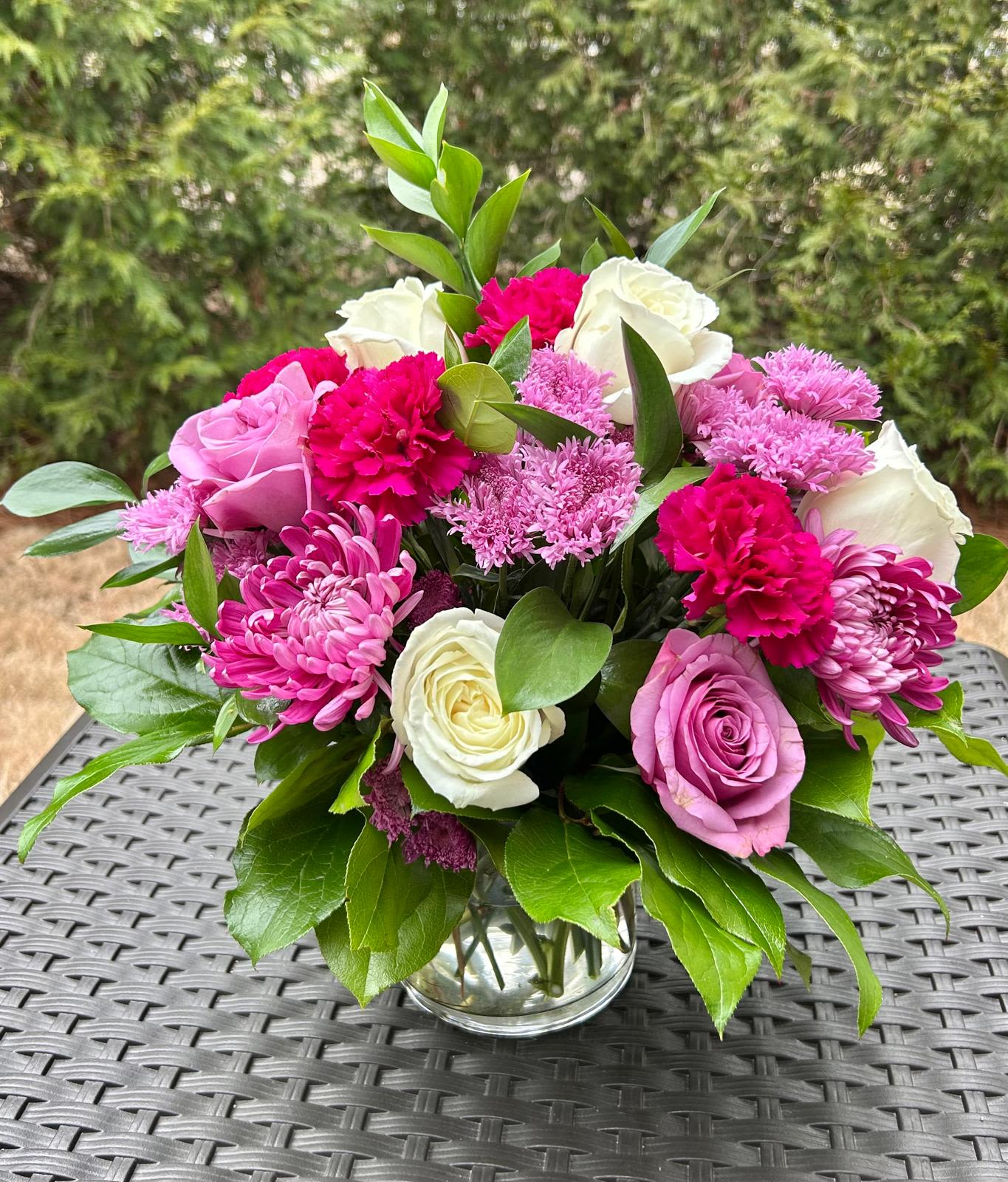 Madison Bouquet - All Occasion Crystal Clear Glass Vessel  Place your Order Online Monday to Saturday before 1:00 p.m. (E.T.) for same-day delivery. “Orders received after hours will be delivered the next business day”. Check our coverage area. Occasionally, flowers and/or containers are substituted due to weather, seasonality, and market conditions, which may affect availability. If this is the case with the gift you’ve selected, we will ensure that your arrangement's style, theme, and color scheme are preserved and will only substitute items of equal value or higher value.  CARE INSTRUCTIONS Keep the flower arrangement hydrated with natural water and change the water every two days. Do not spray any cleaning product on the flower arrangement. Do not place heavy objects directly on the flower arrangement. Keep flower arrangements out of direct sunlight and extreme heat.