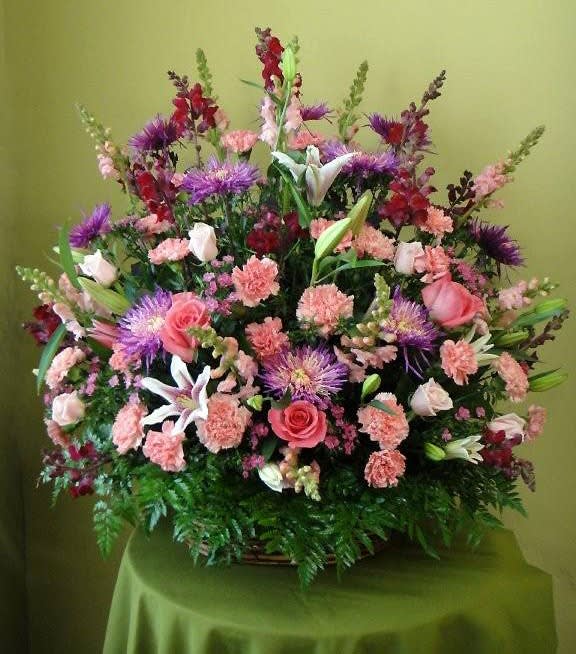 Large mixed bouquet with pink roses, lilies, and purple flowers