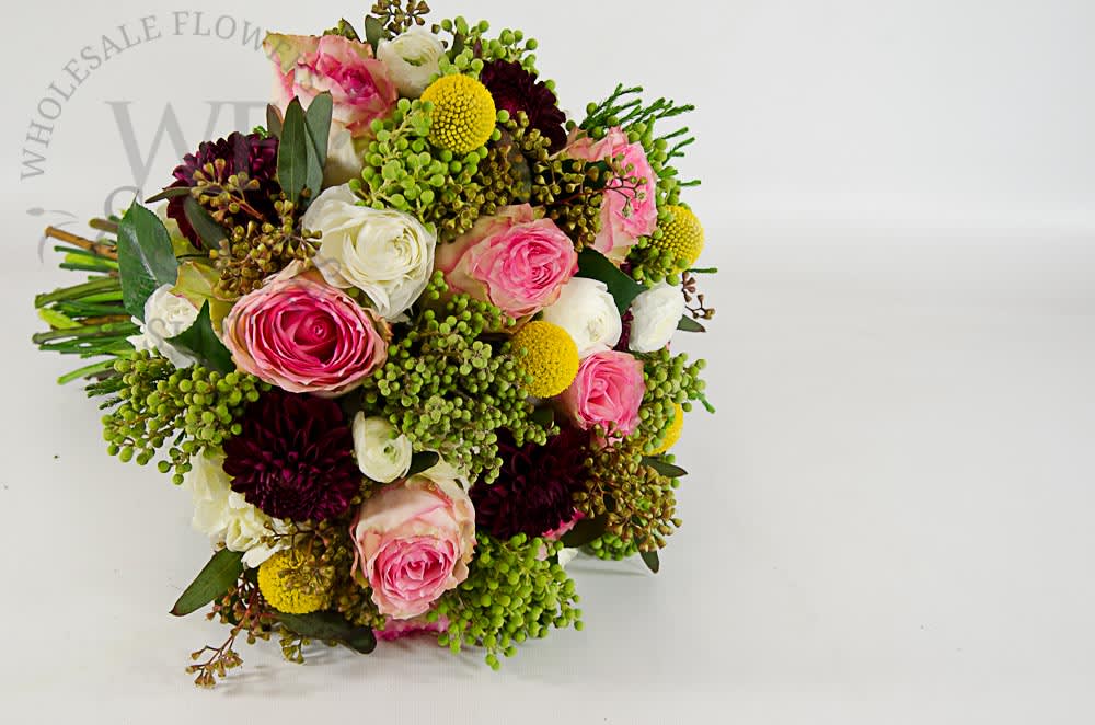 Mixed bouquet of pink, white, and burgundy flowers with green accents