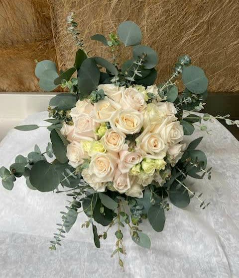 Bouquet of cream roses with eucalyptus greenery