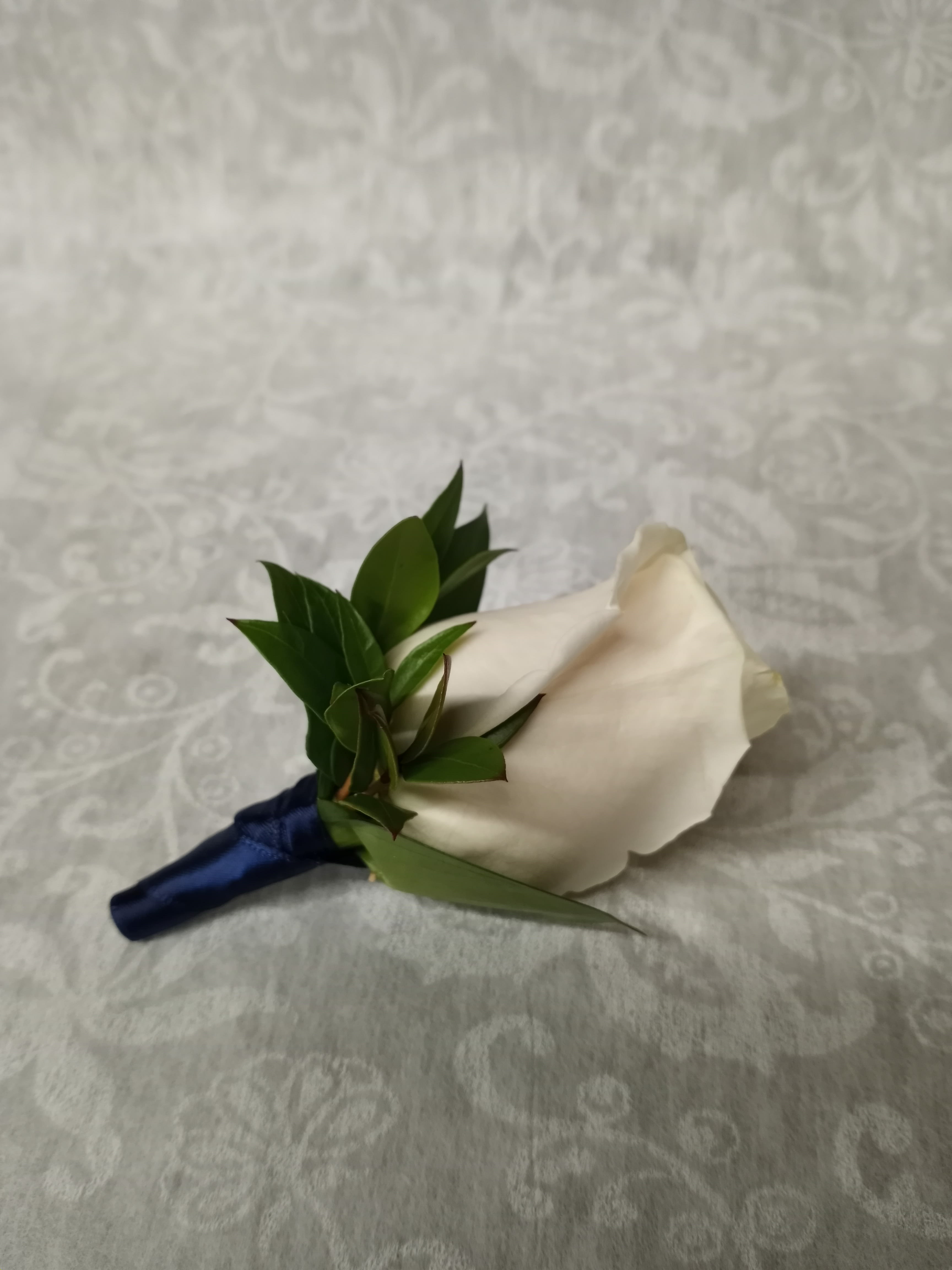 White rose boutonniere with dark blue ribbon wrap