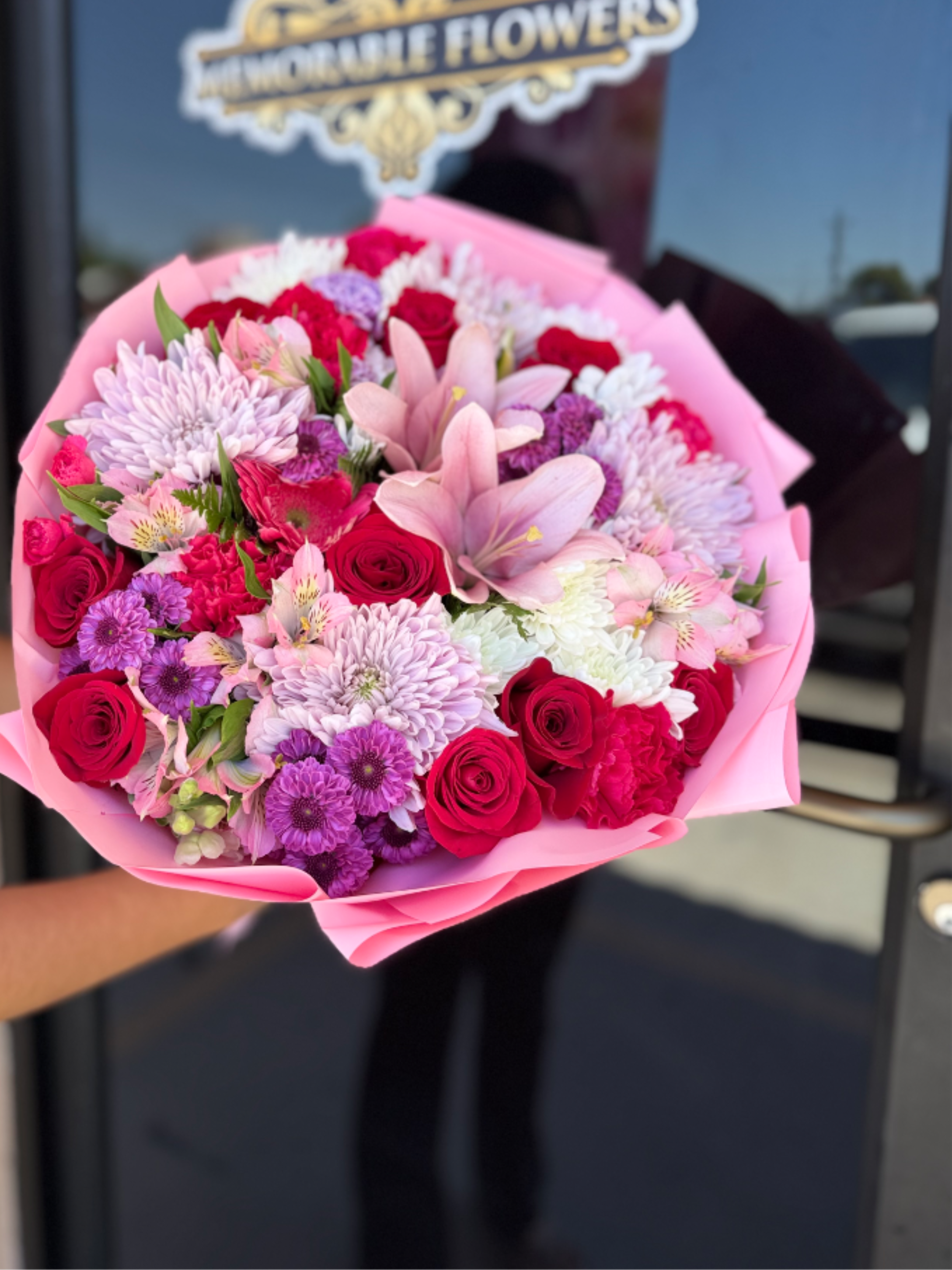 Mix Flower Bouquet  - The Mixed Flower Bouquet features a stunning array of roses and carnations, beautifully complemented by delicate fillers. Each bloom comes together in perfect harmony, creating a heartfelt gift that can brighten anyone's day. Whether it's for a cherished friend, a loved one, or even yourself, this bouquet embodies the warmth and joy that flowers bring into our lives.  *Colors may vary. *Wrapped Medium-sized BQ
