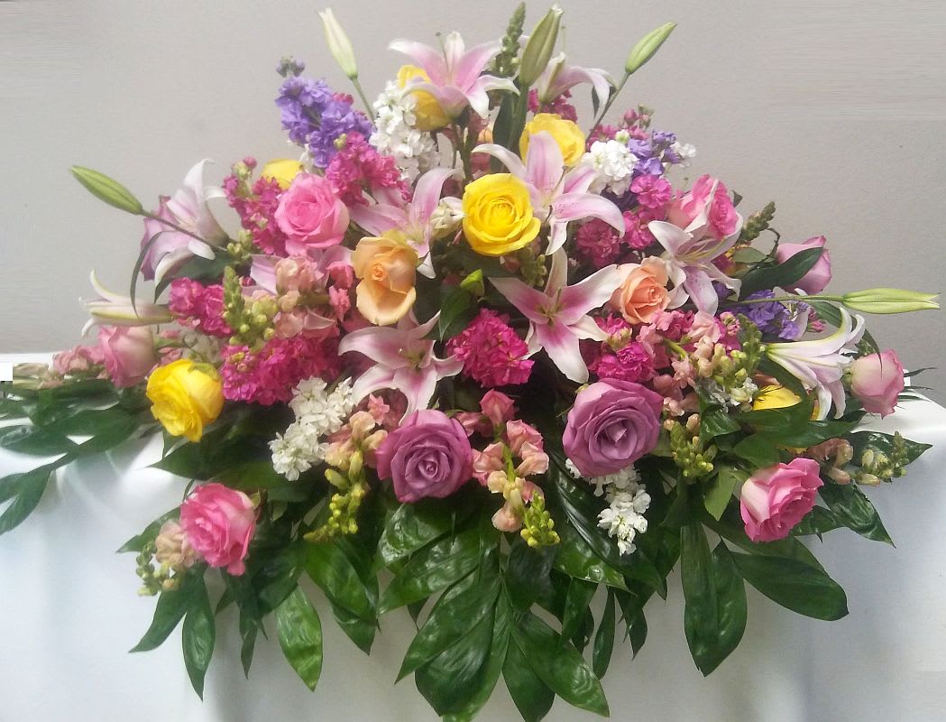 Large mixed bouquet of pink, yellow, and white flowers