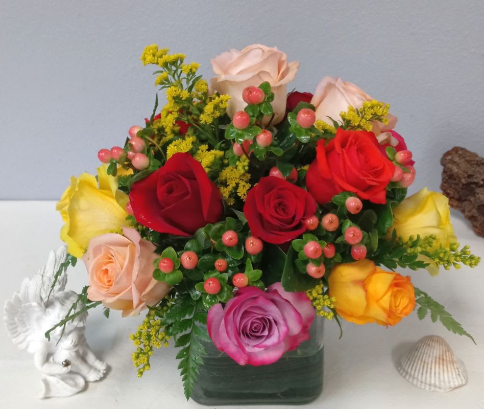 Kaleidoscope  - A full-color explosion, Kaleidoscope by BloomNation™ is a beautiful gift for anybody you want to impress. Mother-in-law, your boss, a client, etc... this arrangement is a crowd pleaser and an eye-catcher.  Approximate Dimensions: 14"D x 14"H