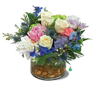 Breathtaking Blossoms - You’d like to surprise someone with gorgeous fresh flowers…a mix of blooms that looks as if the entire garden has been put into a vase! This splendid medley of blue, cream, white, pink and lavender flowers, presented on a bed of river rocks, is a beautiful choice.