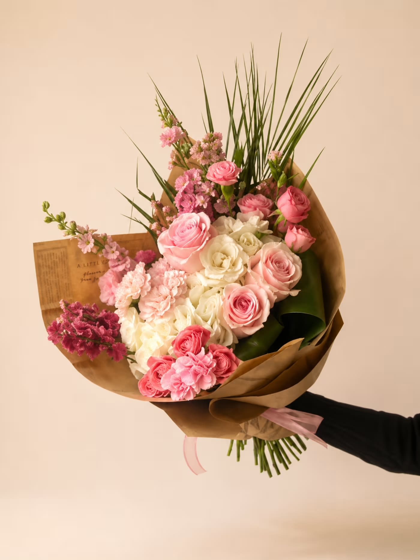 Sweet Pinks  - White hydrangeas, light pink larkspur, komachi carnations, mini carnations, novia roses, mini spray roses, and accents of palm leaves
