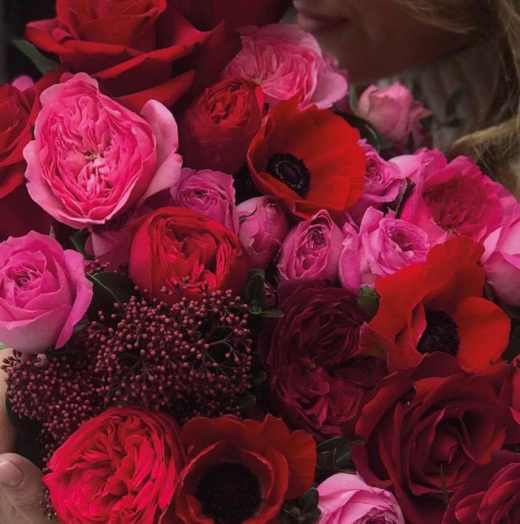 Bouquet of red and pink roses with red anemones