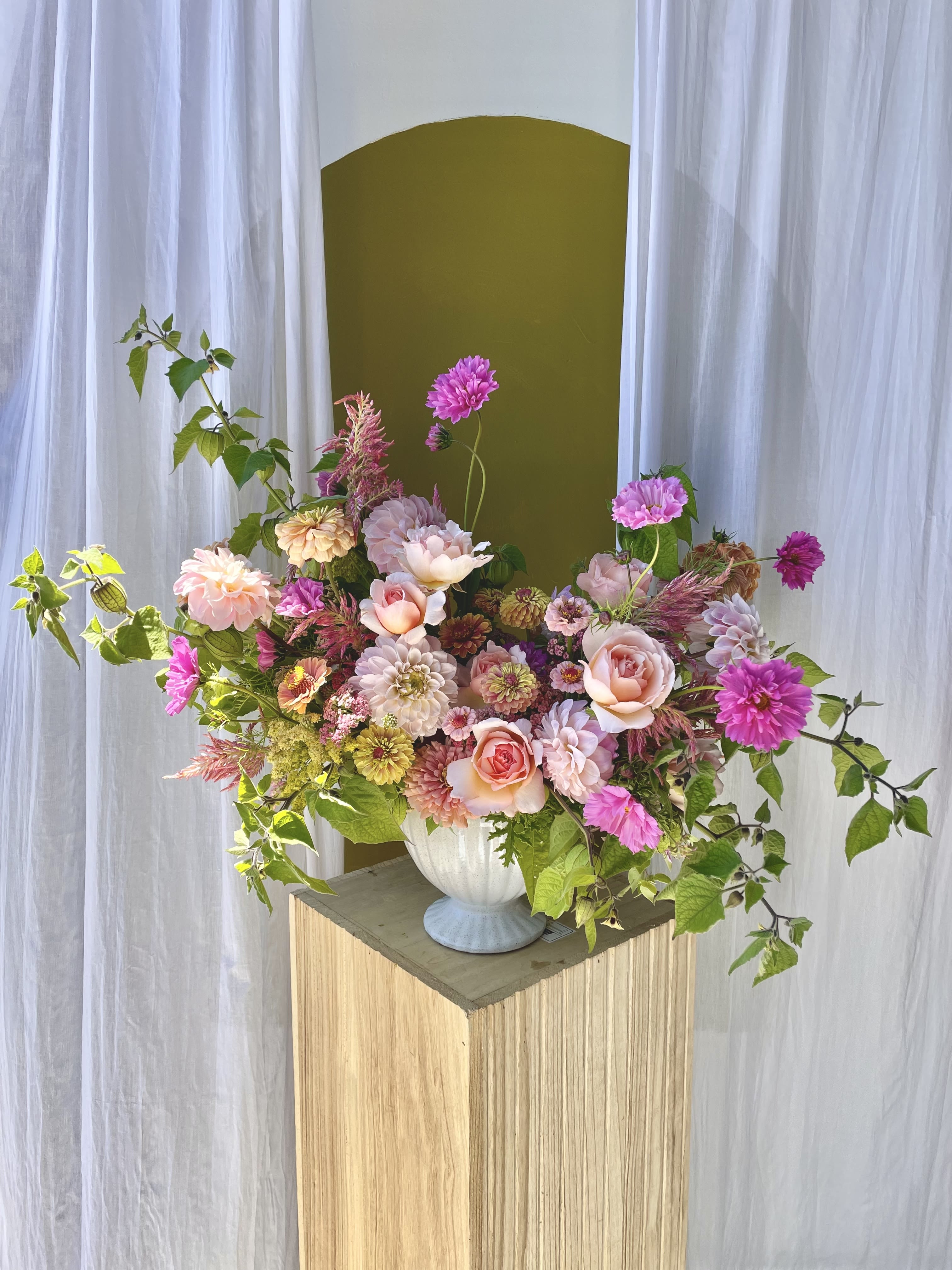 Blush Seasonal Statement  - A beautiful garden-style arrangement packed with summer blooms in a blush/pastel color palette. Fashioned in a large white compote.   Concerning Seasonality: As a seasonal, locally-focused florist, we have different product to work with each week. Our focus is on creating a unique piece for each customer, with blooms that are fresh from local farms and growers. While the flower varieties and colors may vary, the quality and freshness will always be the best. It is an honor to have our customers' trust and confidence in our abilities and artistic eye.   Delivery Policy: Pick-ups at the studio are available after 2pm. Our daily delivery time frame is between 12- 3 PM. Please specify if you require a certain delivery time and we will do our best to accommodate it, or we will call you if we cannot. Please include any gate codes if applicable! If there is no answer at the door, our delivery person will leave the flowers by the doorstep in a weather safe location or contact you to reschedule the delivery.  Completing your order acknowledges that you have read and understand our delivery policies. 