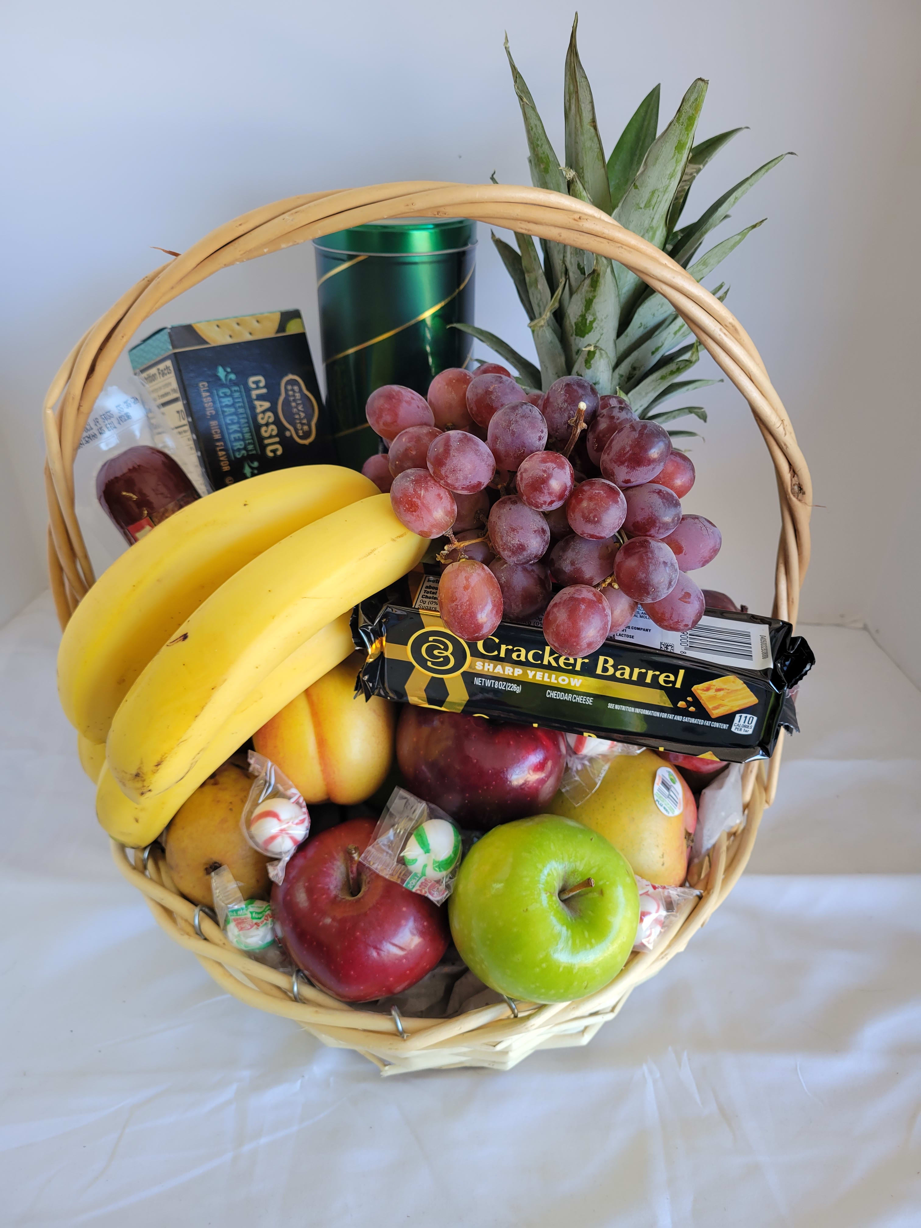Designers choice Fruit &amp; Gourmet Basket  - Reach out to family members and friends to express your caring thoughts . Comforting basket of orchard-fresh fruit (variety may vary based on availability) and gourmet snacks (variety may vary due to availability). Selected and arranged by our FlowerBee floral artisans.  We can customize any basket as the best to our abilities. Alcohol (must be 21 to receive) may be added for an additional charge.  Please make any notes in special instructions or give us a call.  Fruit and snack assortment, floral and basket may vary due to local availability