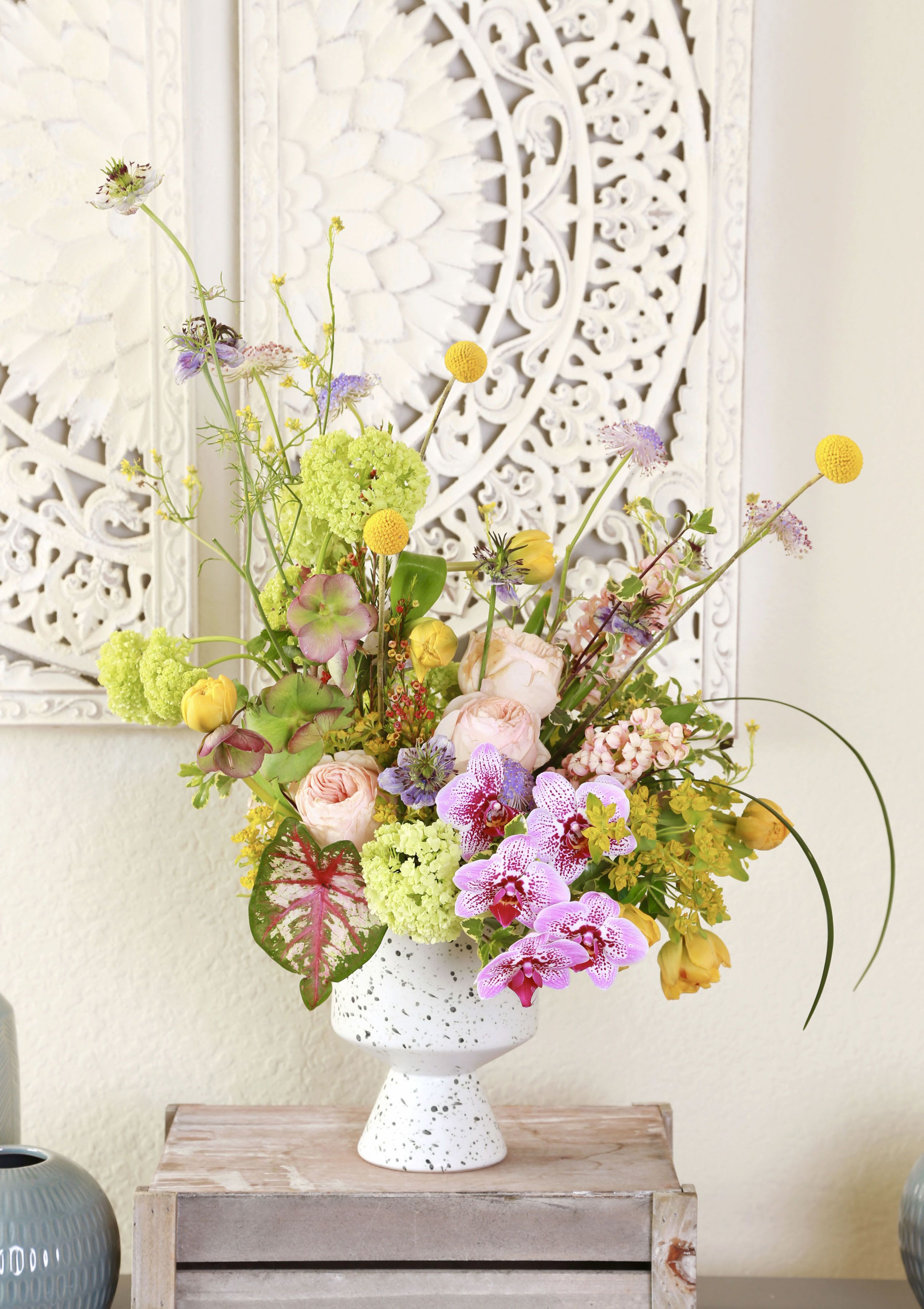 Garden Love Melody - A joyful Mother's Day arrangement with Orchids, garden roses, Viburnum, Hellebore and playful textures in soft pastels and fresh green, - Light, elegant, and full of spring energy. The arrangement will be delivered with Branded gifted box as pic and card
