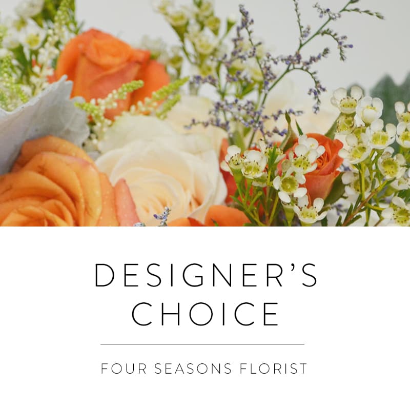 Orange and white roses with small white filler flowers