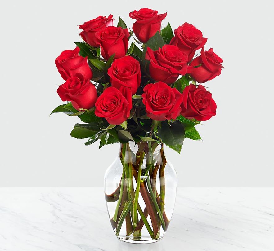 Bouquet of red roses in a clear glass vase