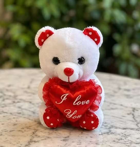 Small Plush Teddy Bear with Heart - A soft and adorable plush teddy bear holding an “I Love You” heart. Perfect for Valentine’s Day, anniversaries, birthdays, or just because. A charming keepsake that pairs beautifully with any bouquet or gift. Available in select colors while supplies last.