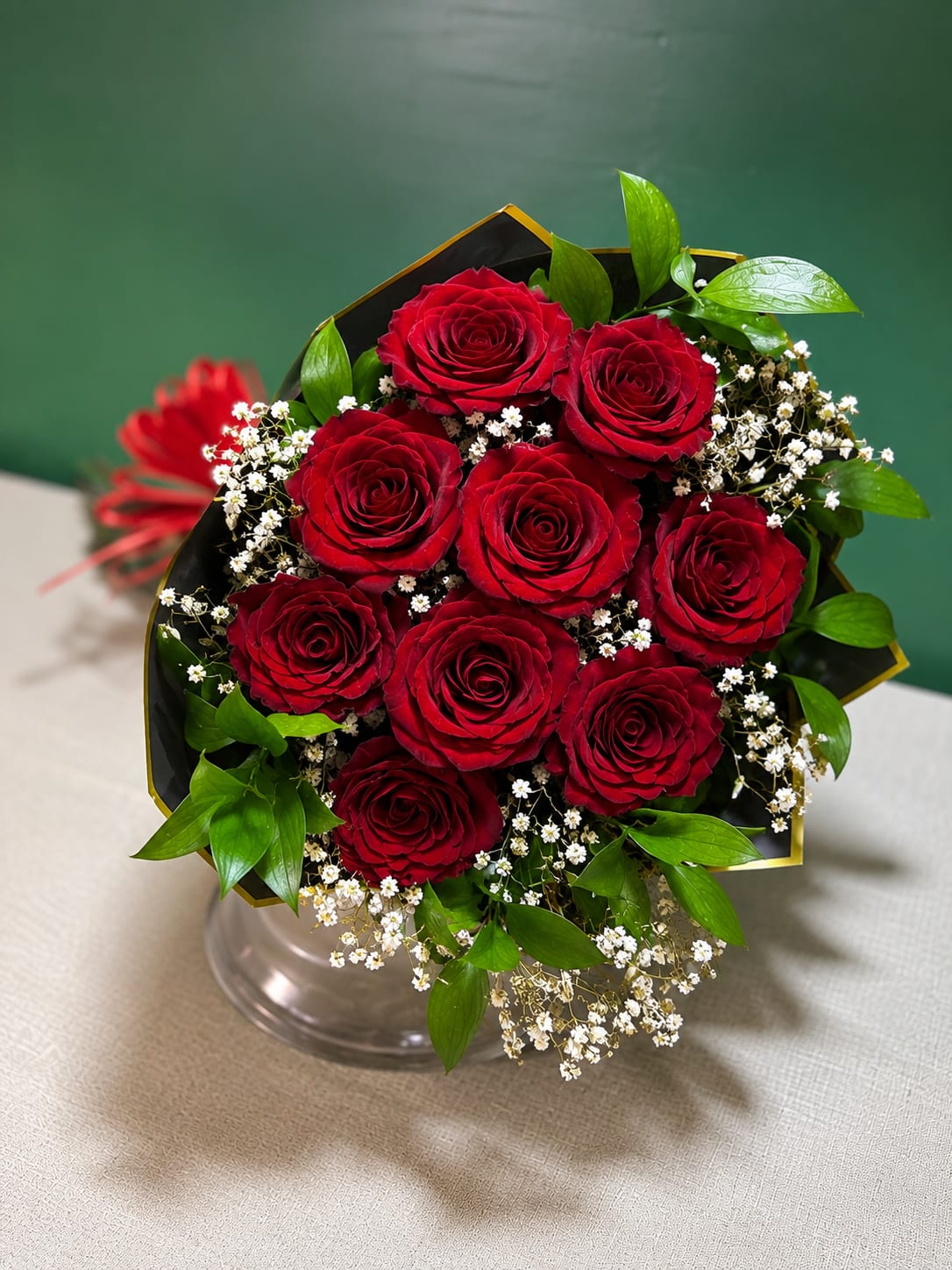 Ruby Red Grab and Go - A beautiful grab-and-go bouquet featuring premium red roses, baby’s breath, and fresh greenery. Wrapped and ready for gifting—perfect for anniversaries, birthdays, or a thoughtful surprise.  