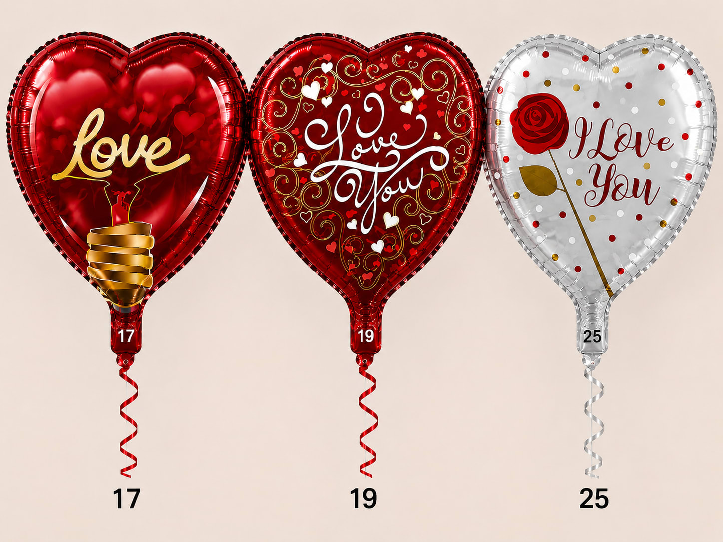 Three heart-shaped foil balloons with love messages and curled ribbons