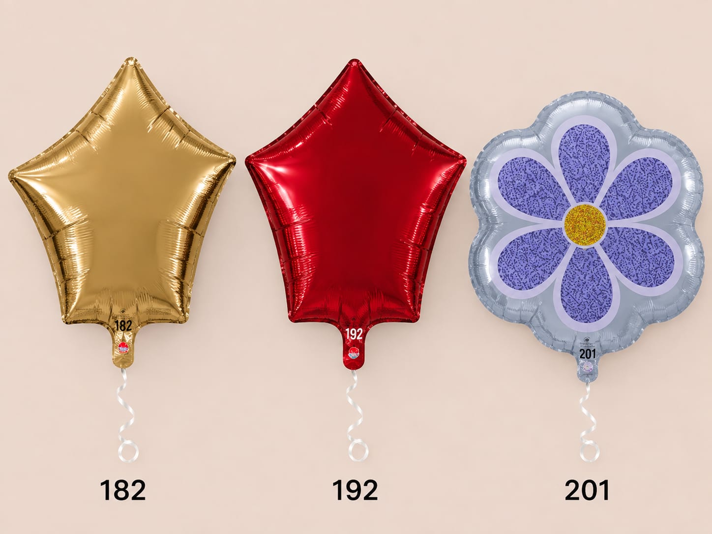 Three foil balloons: gold star, red star, and a purple flower shape.