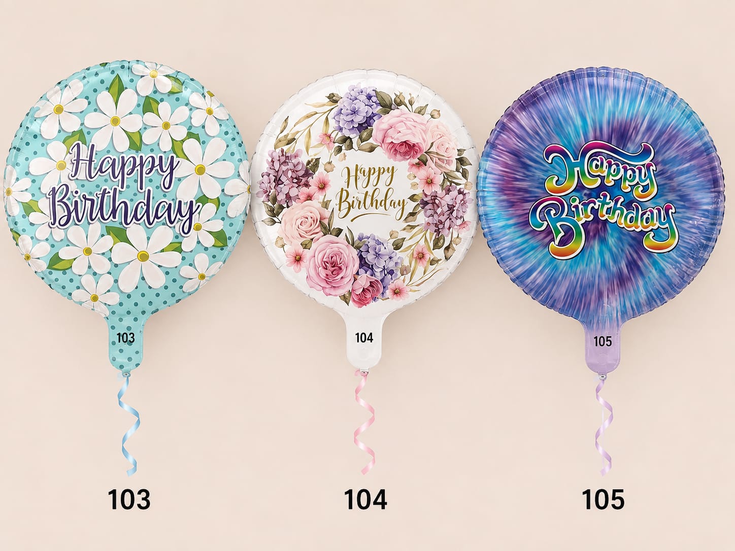 Three birthday balloons with floral prints and curled ribbons