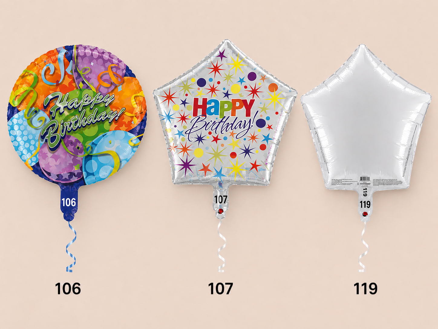 Three birthday foil balloons, including round and star shapes, with curled ribbons.