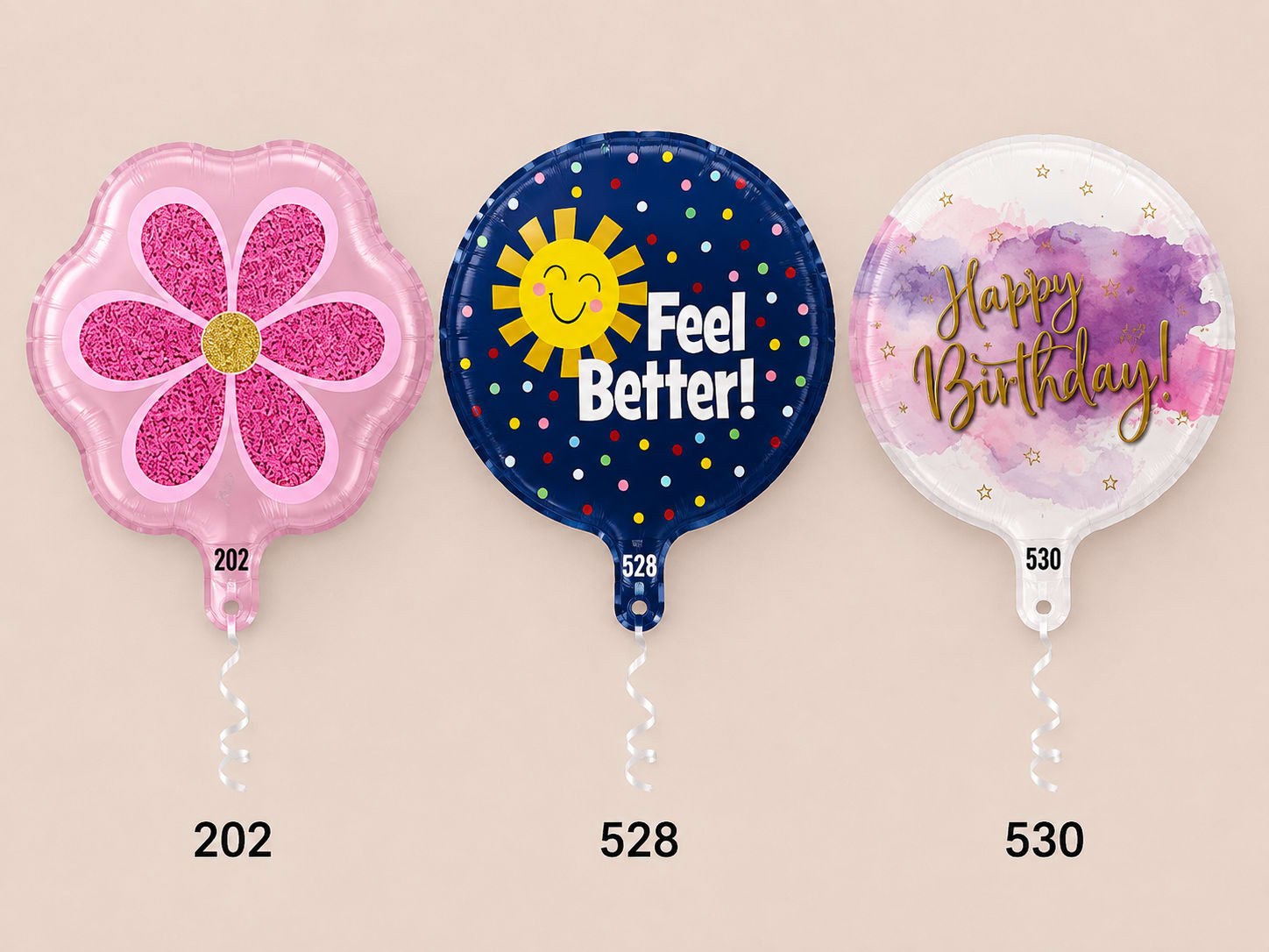 Three round foil balloons, including a pink flower and two birthday-themed designs.